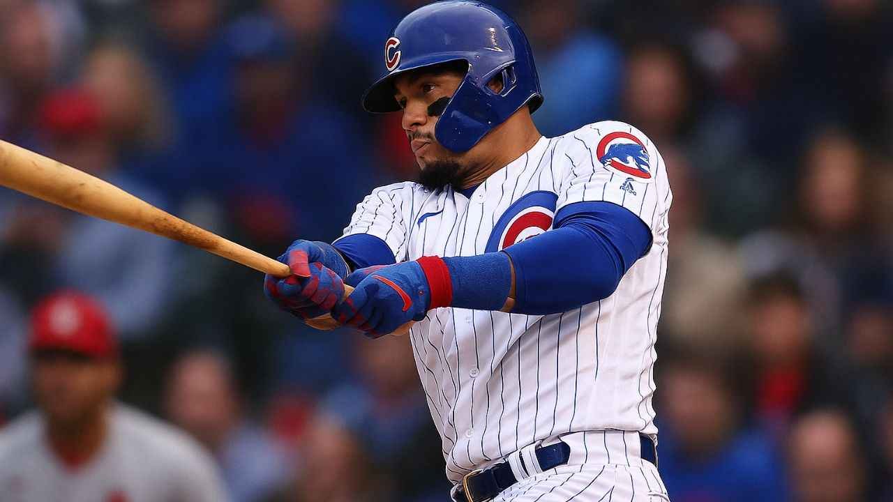 Chicago Cubs vs St. Louis Cardinals Match Player Stats Javier Báez swinging a bat during a home run or making a defensive play